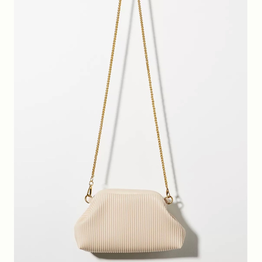 Cute cream colored Anthropologie purse!